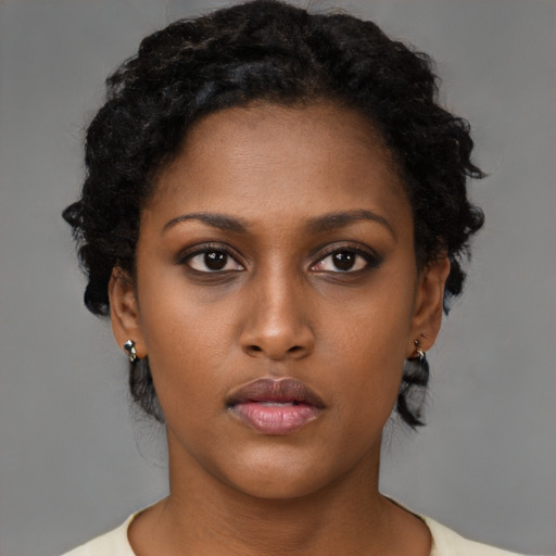 Neutral black young-adult female with short  brown hair and brown eyes