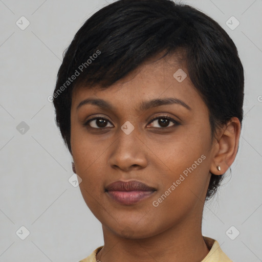 Joyful black young-adult female with medium  black hair and brown eyes
