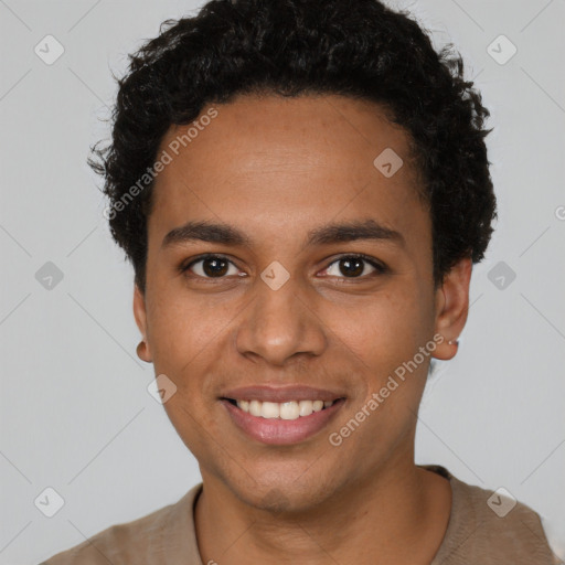 Joyful black young-adult male with short  brown hair and brown eyes