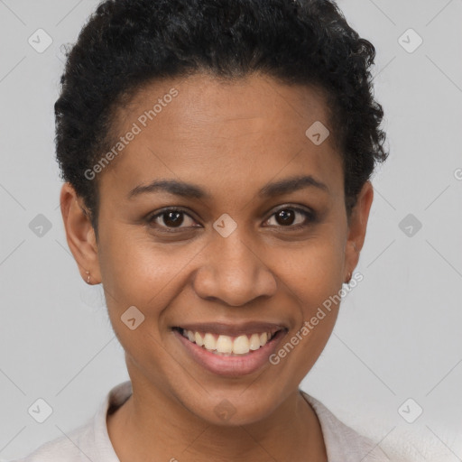 Joyful black young-adult female with short  brown hair and brown eyes