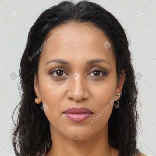 Joyful latino young-adult female with long  brown hair and brown eyes