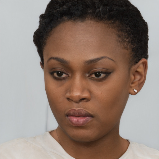 Neutral black young-adult female with short  brown hair and brown eyes