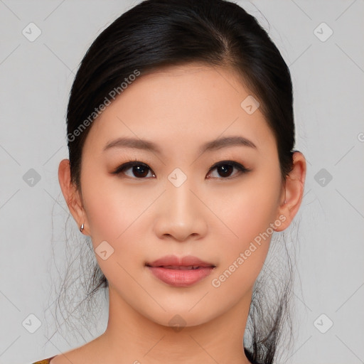 Joyful asian young-adult female with medium  black hair and brown eyes