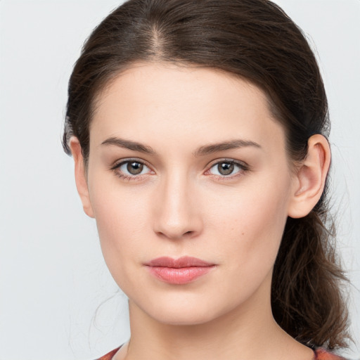 Neutral white young-adult female with medium  brown hair and brown eyes