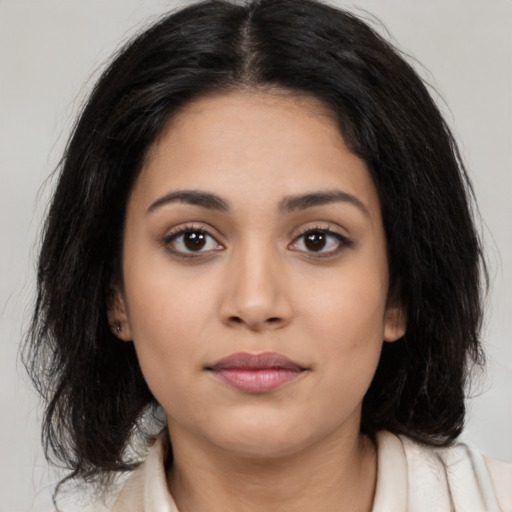 Neutral latino young-adult female with long  black hair and brown eyes