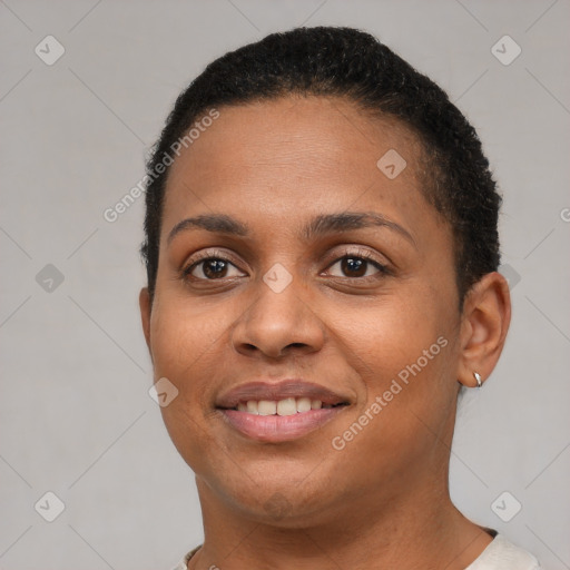 Joyful black young-adult female with short  brown hair and brown eyes