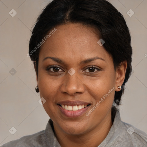 Joyful black adult female with medium  brown hair and brown eyes