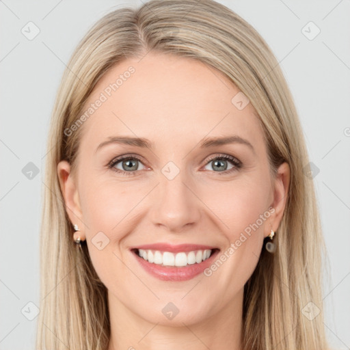 Joyful white young-adult female with long  brown hair and blue eyes