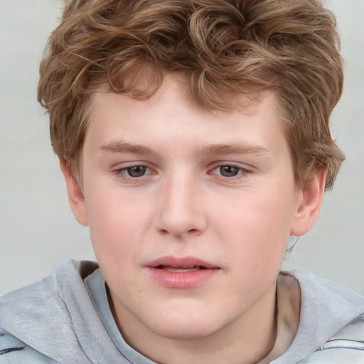 Joyful white child male with short  brown hair and grey eyes