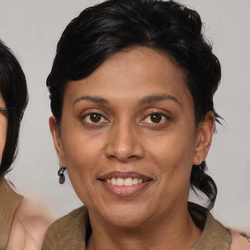 Joyful asian adult female with medium  brown hair and brown eyes