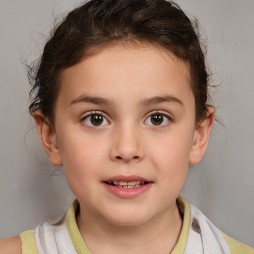 Joyful white child female with medium  brown hair and brown eyes