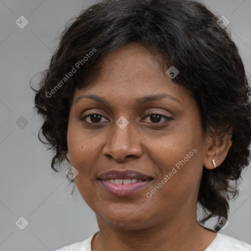 Joyful latino adult female with medium  brown hair and brown eyes