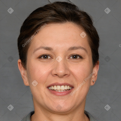 Joyful white adult female with short  brown hair and grey eyes