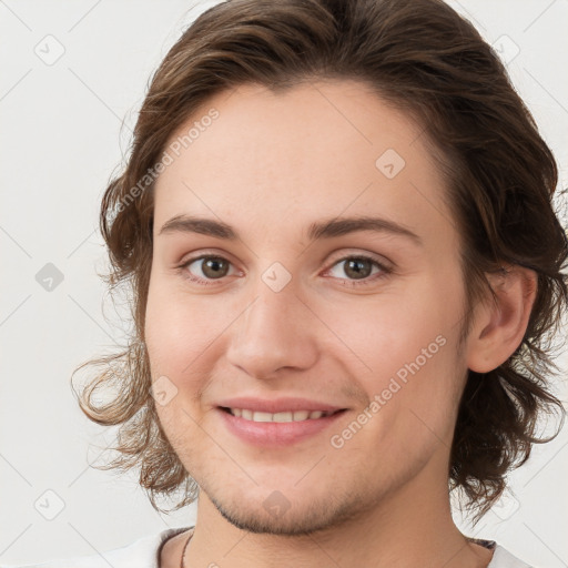 Joyful white young-adult female with medium  brown hair and green eyes