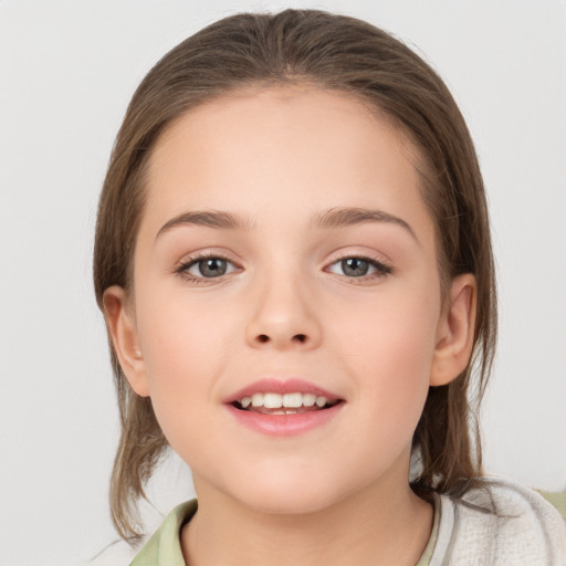 Joyful white child female with medium  brown hair and brown eyes