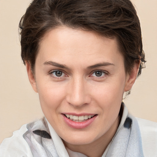 Joyful white young-adult female with short  brown hair and brown eyes