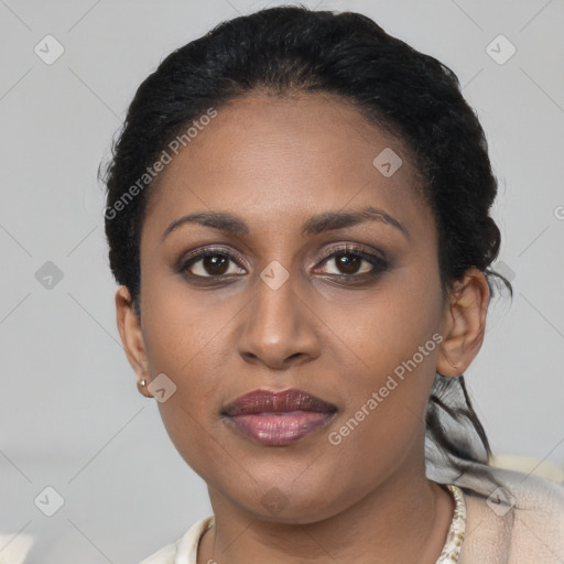 Joyful latino young-adult female with short  brown hair and brown eyes