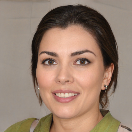 Joyful white young-adult female with medium  brown hair and brown eyes