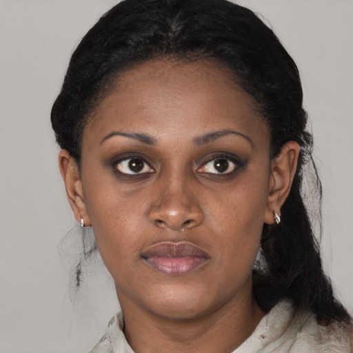 Joyful black young-adult female with medium  black hair and brown eyes