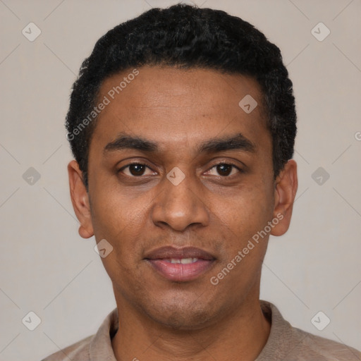 Joyful black young-adult male with short  black hair and brown eyes