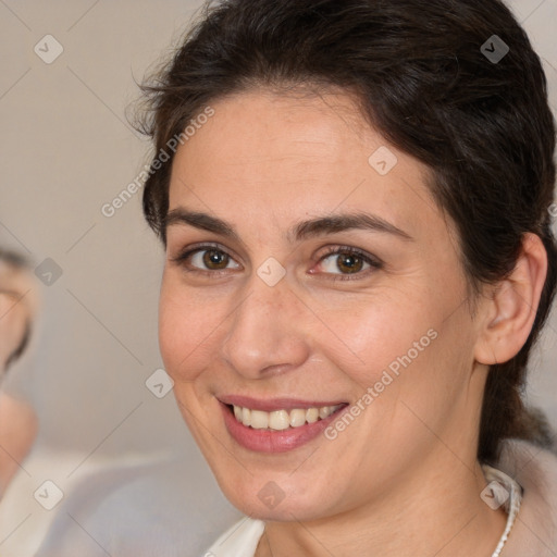 Joyful white adult female with medium  brown hair and brown eyes