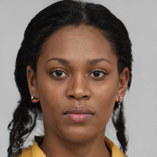 Neutral black young-adult female with long  brown hair and brown eyes