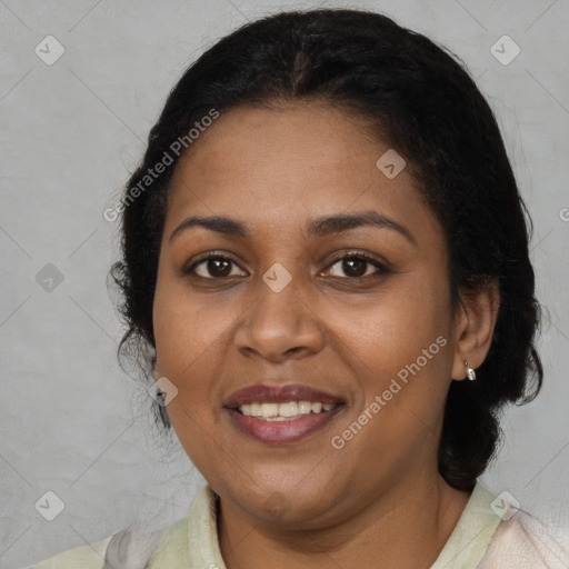 Joyful black adult female with medium  brown hair and brown eyes