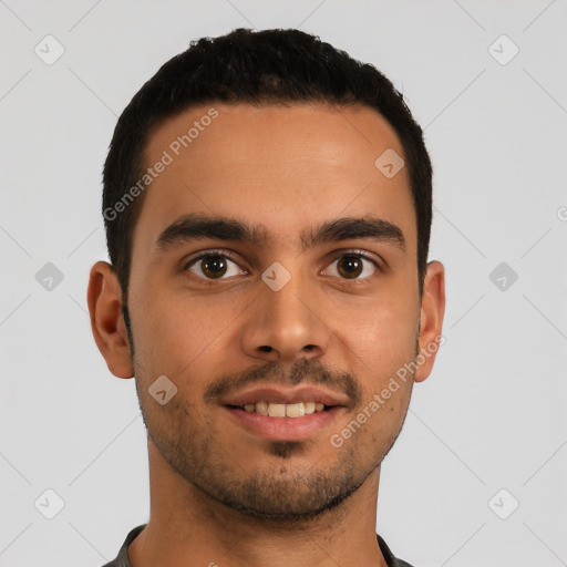 Joyful latino young-adult male with short  brown hair and brown eyes