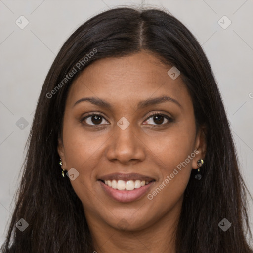 Joyful black young-adult female with long  brown hair and brown eyes