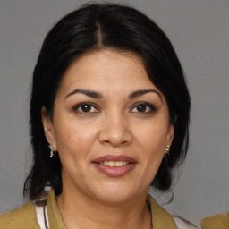 Joyful white adult female with medium  brown hair and brown eyes
