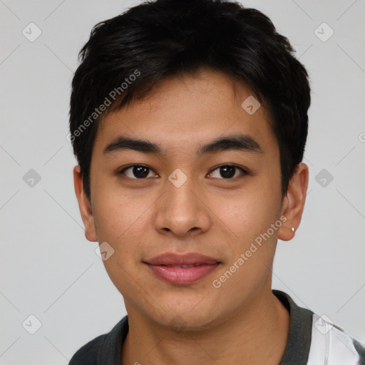 Joyful asian young-adult male with short  black hair and brown eyes