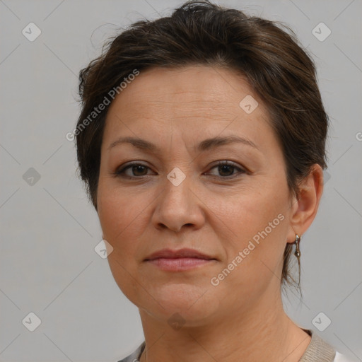 Joyful white adult female with short  brown hair and brown eyes