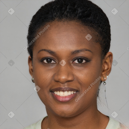 Joyful black young-adult female with short  brown hair and brown eyes