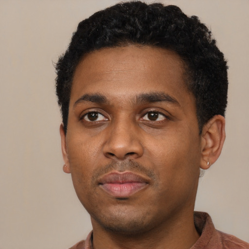 Neutral black young-adult male with short  black hair and brown eyes