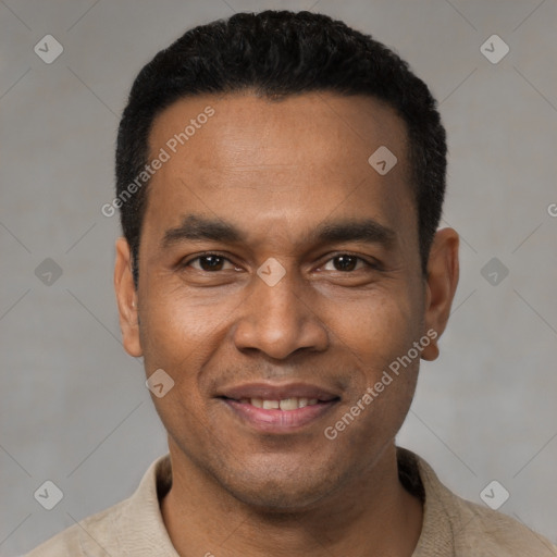 Joyful latino young-adult male with short  black hair and brown eyes