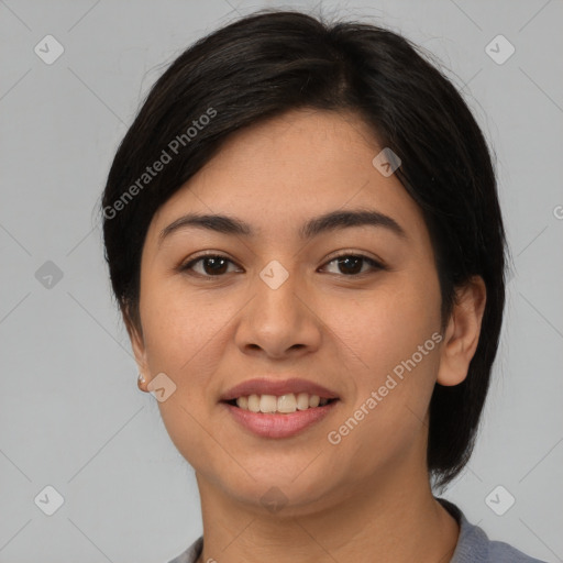 Joyful asian young-adult female with medium  black hair and brown eyes