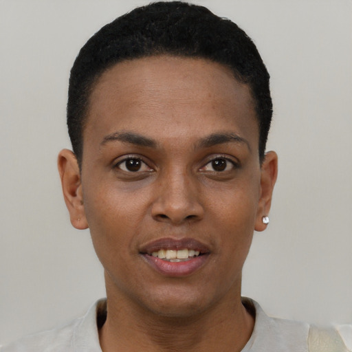 Joyful black young-adult female with short  brown hair and brown eyes