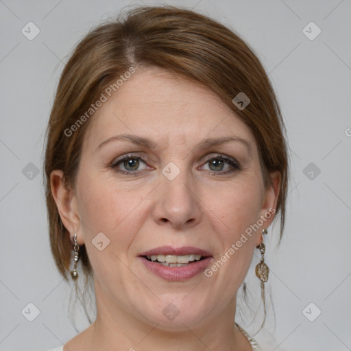 Joyful white adult female with medium  brown hair and grey eyes