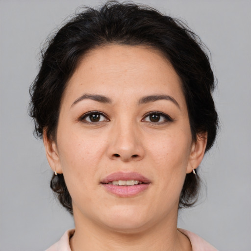 Joyful white adult female with medium  brown hair and brown eyes
