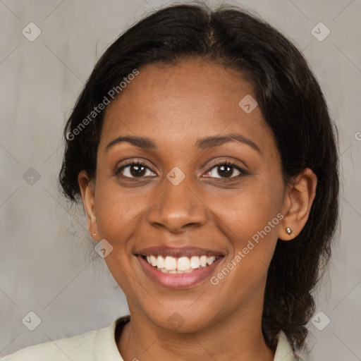 Joyful black young-adult female with medium  brown hair and brown eyes