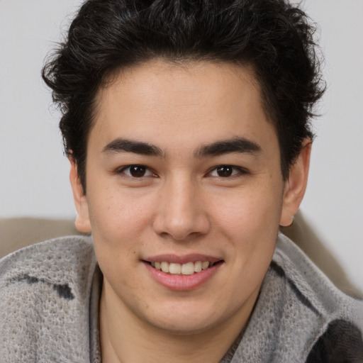 Joyful latino young-adult male with short  brown hair and brown eyes