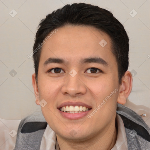 Joyful white young-adult male with short  black hair and brown eyes