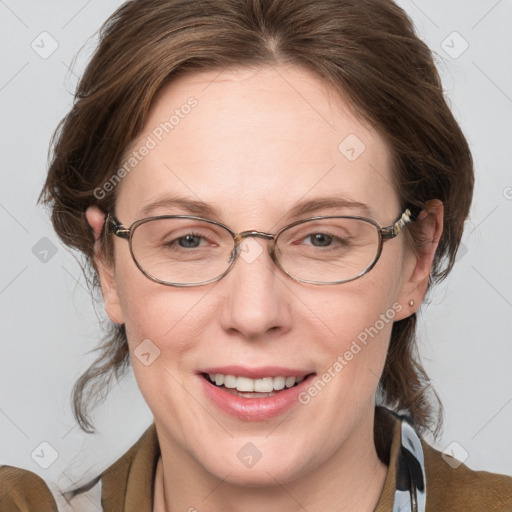 Joyful white adult female with medium  brown hair and blue eyes