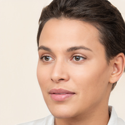 Joyful white young-adult female with short  brown hair and brown eyes