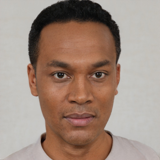 Neutral black young-adult male with short  black hair and brown eyes
