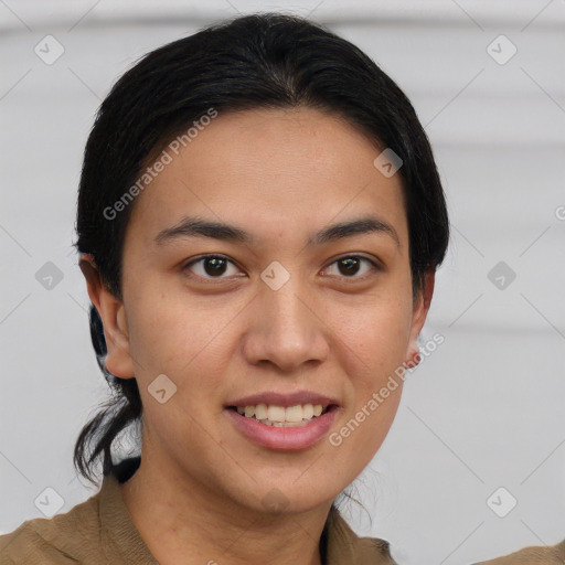 Joyful latino young-adult female with short  brown hair and brown eyes