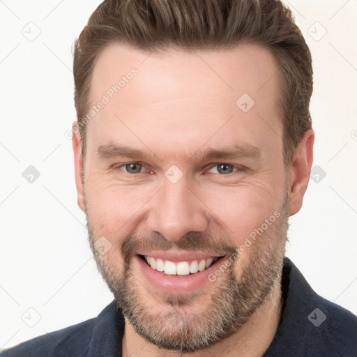 Joyful white young-adult male with short  brown hair and brown eyes