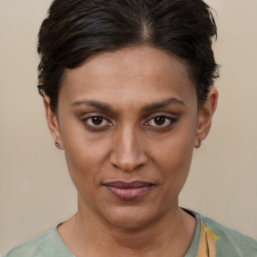 Joyful latino young-adult female with short  brown hair and brown eyes