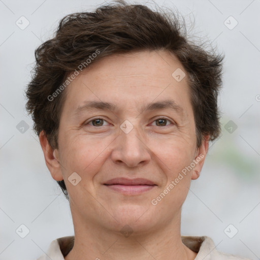 Joyful white adult female with short  brown hair and brown eyes