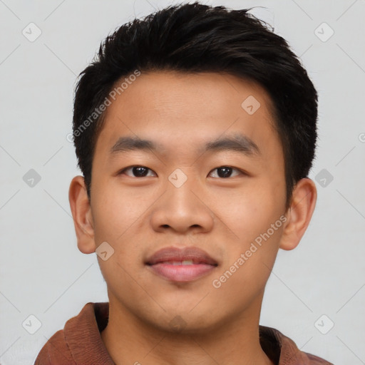 Joyful asian young-adult male with short  black hair and brown eyes